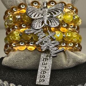 Yellow and Orange Beaded Bracelet with Silver Charms